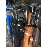 Two golf bags and clubs