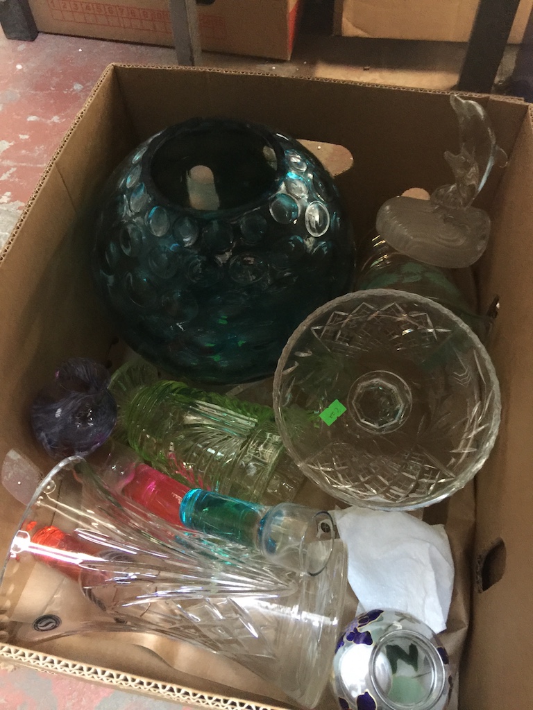 A box of glassware including coloured bowls etc