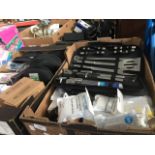 2 boxes of household items including barbecue sets, headphones and coded locks
