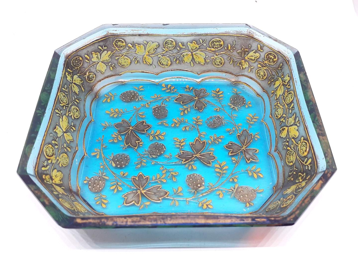 A gilt overlaid blue glass pin dish.