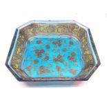 A gilt overlaid blue glass pin dish.