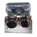 Four pairs of vintage sunglasses comprising Gucci, Ray Ban(2) and Bvlgari.