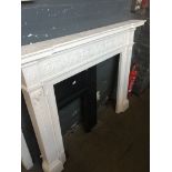 A large white plastic fire surround