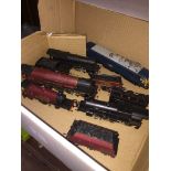 A box containing model railway engines etc