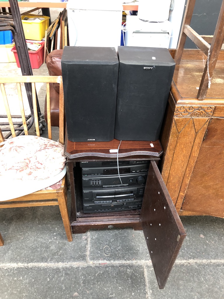 A Sony Hifi stereo system in cabinet and speakers