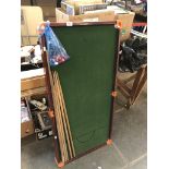 A Chad Valley small snooker table, cues and balls.