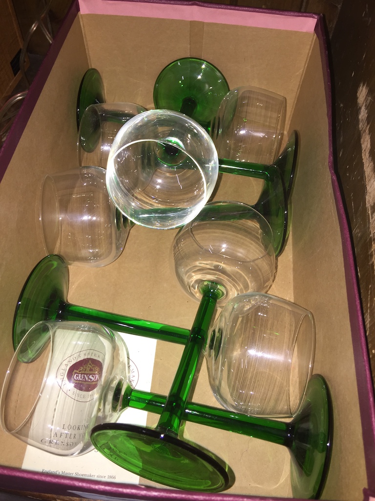 A box of green stemmed wine glasses