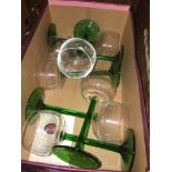 A box of green stemmed wine glasses