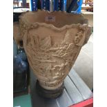 An eastern resin carved vase