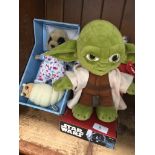 A Meerkat soft toy together with a Yoda soft toy
