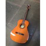 An Angelico accoustic guitar with case