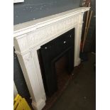A large white plastic fire surround