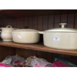 A Le Creuset cast iron casserole and two others
