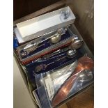 A box of collectors spoons including Rolex Bucherer