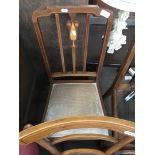 An antique art and crafts inlaid chair