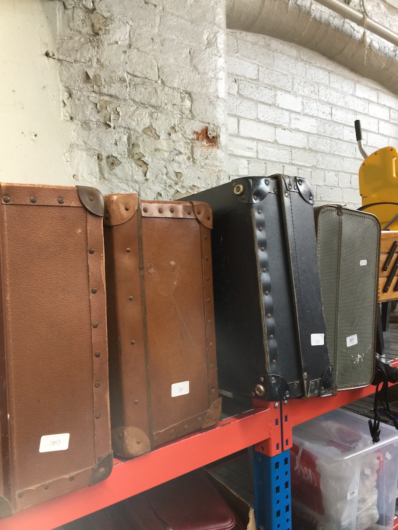 Four vintage suitcases