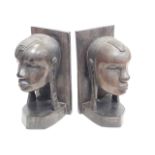 A pair of African carved ebony bookends, height 23.5cm.
