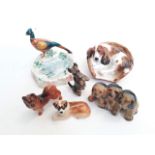 A group of six animal figure groups comprising three Royal Doulton, one Beswick and two others.