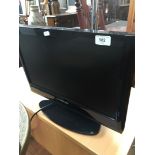 A Toshiba 19" LCD TV with remote.