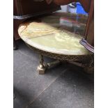 An onyx and brass effect coffee table