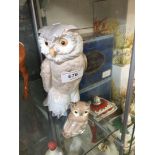 A Nao large and small owl figures