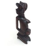 A carved African figure, height 30cm.