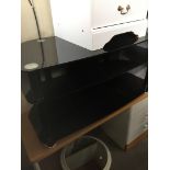 A black glass tv stand