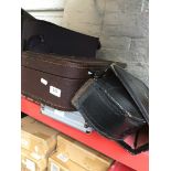 3 empty instrument cases