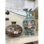 A vase/container of Peruvian origin and a Japanese relief patterned jug