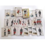 Three sets of playing cards comprising an incomplete set of WWI armies, Peter Pan and another.