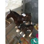 A Beswick shire horse and foal.
