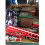 A mixed box with old tins, thermometer, etc