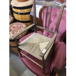 A childs chair with wicker seat