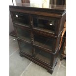 A mahogany Simpoles Chapter sectional Bookcase with glazed doors