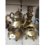 Brass tea/coffee pots, sugar bowl, creamer and a pair of brass candlesticks