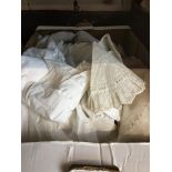 A box of lace, christening items, etc