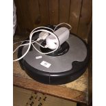 An Irobot Roomba robot vac