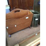 A teak magazine rack and brass coal bucket