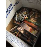 A box of mainly DVDs and CDs