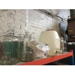 A quantity of demijohns and wine making equipment.