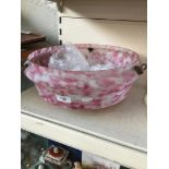 A vintage pink and white patterned glass ceiling light shade
