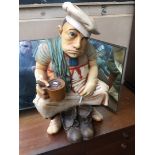 A wooden chef statue