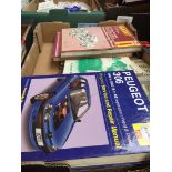 A box of car manuals, etc