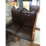 Three faux leather dining chairs