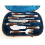 A Victorian cased silver plated carving set by James Deakin & Sons Sheffield.