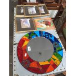 A multicoloured mosaic circular mirror and 5 pictures.