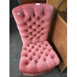 A pink button back bedroom chair