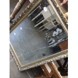 A mirror with etched ship design.