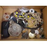 A box of bric a brac and costume jewellery.