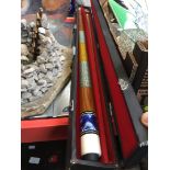 A 2 piece snooker cue in a hard case